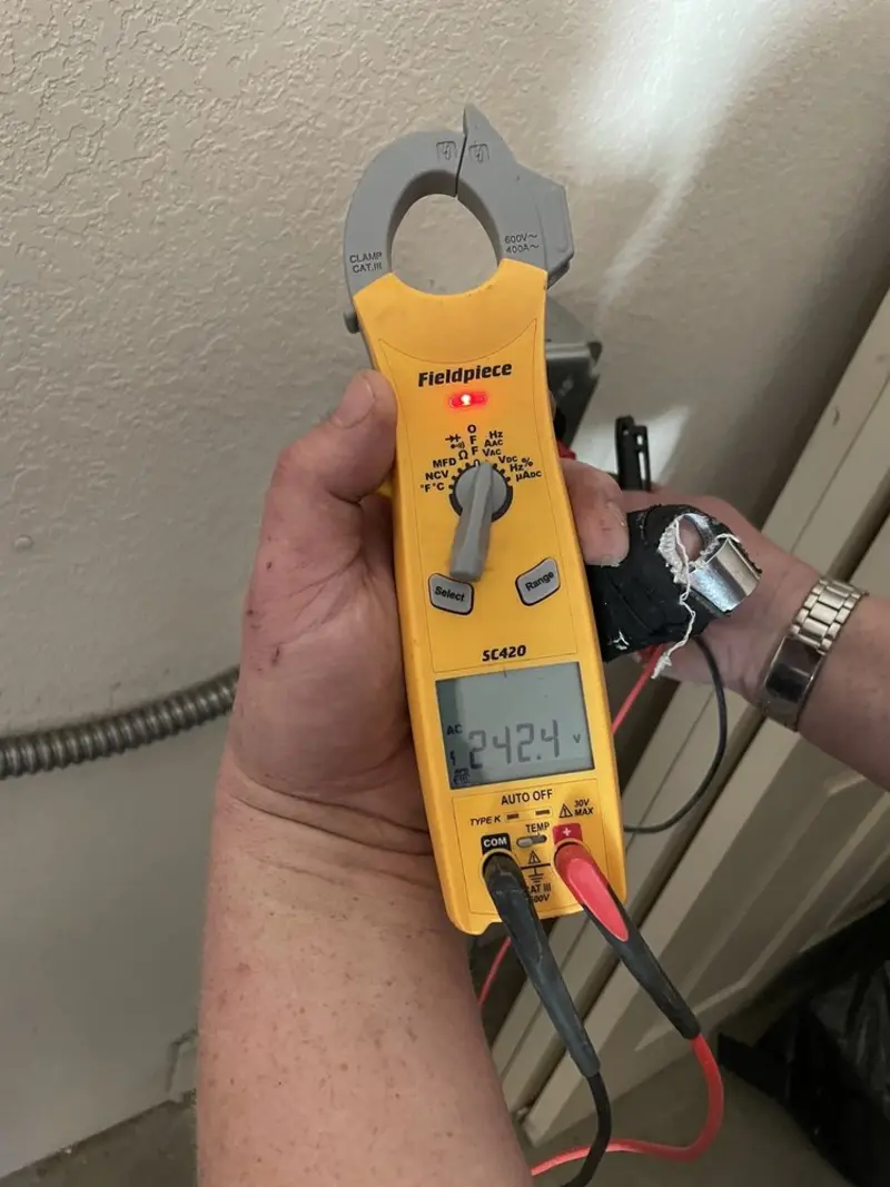 Voltage testing with clamp meter during Circuit Breaker Repair in Bristol